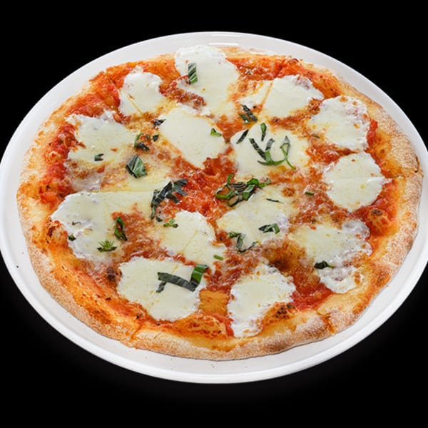 il Mulino's Italian Margherita pizza with fresh mozzarella, tomato sauce, and basil on a white plate.