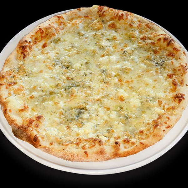 A whole, round Italian four-cheese pizza with a golden crust on a white plate.