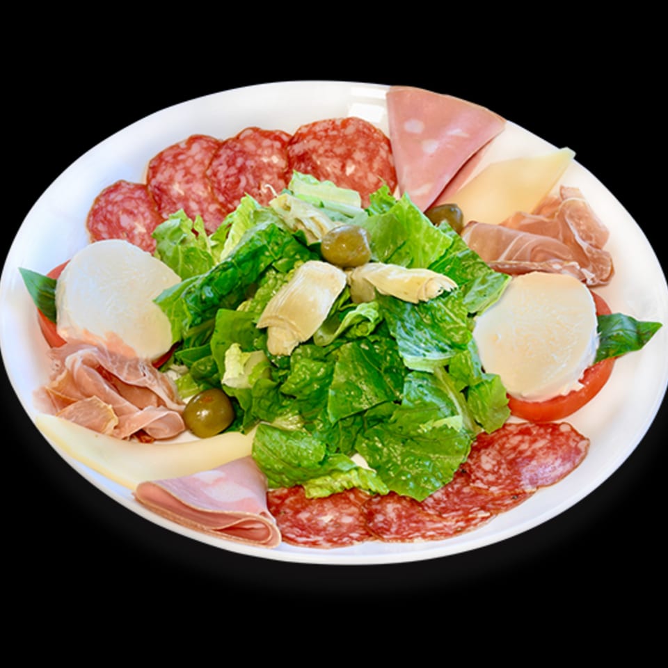 A large antipasto platter with various cured meats, cheeses, fresh mozzarella, salad, and olives.